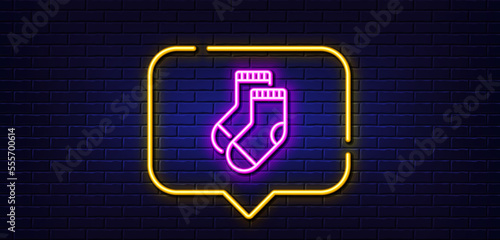 Neon light speech bubble. Socks line icon. Underwear clothing sign. Feet accessory symbol. Neon light background. Socks glow line. Brick wall banner. Vector