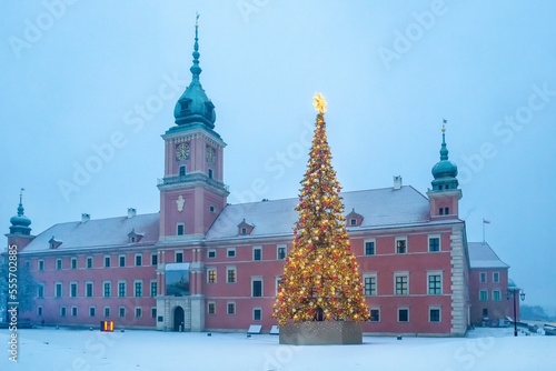  Christmas tree in Warsaw - behind Royal palace (Castle) in morning of December . Snow falling - A winter fairy tale - snow is falling!