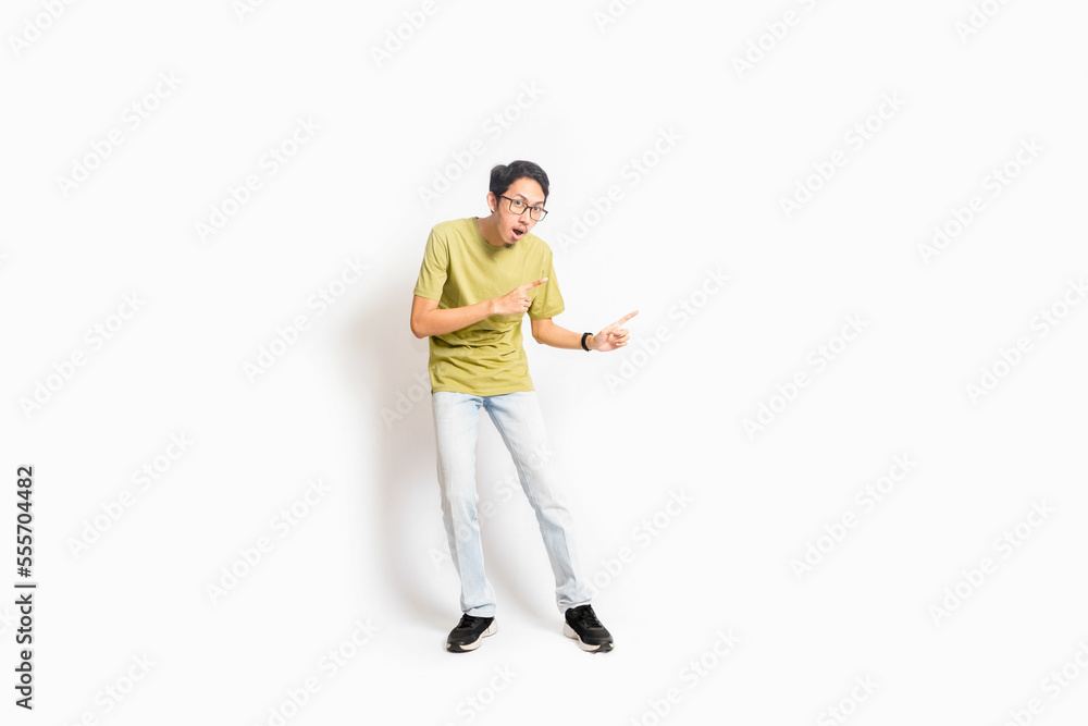 Single skinny young male. The full body of an Asian or Indonesian person. Isolated photo studio with white background. Single skinny young male. The full body of an Asian or Indonesian person. Isolated photo studio with white background.
