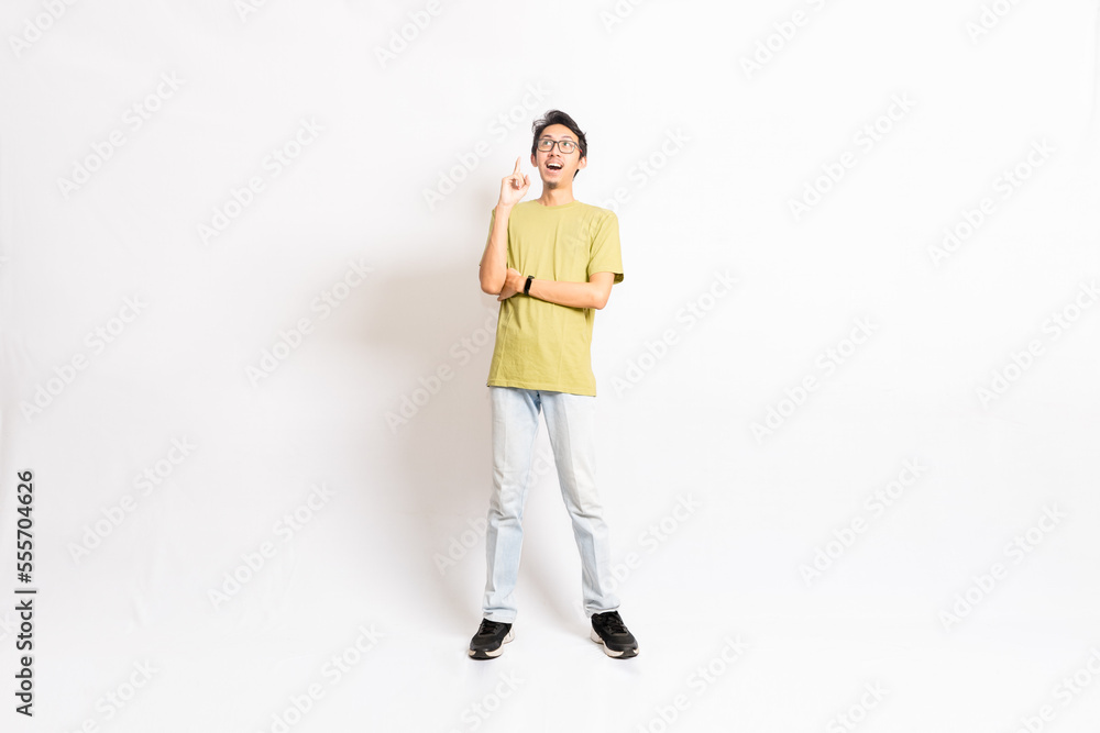Single skinny young male. The full body of an Asian or Indonesian person. Isolated photo studio with white background. Single skinny young male. The full body of an Asian or Indonesian person. Isolated photo studio with white background.