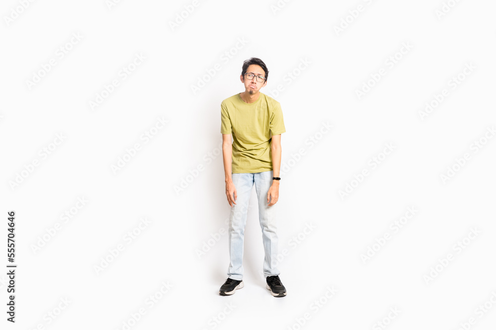Naklejka premium Single skinny young male. The full body of an Asian or Indonesian person. Isolated photo studio with white background.