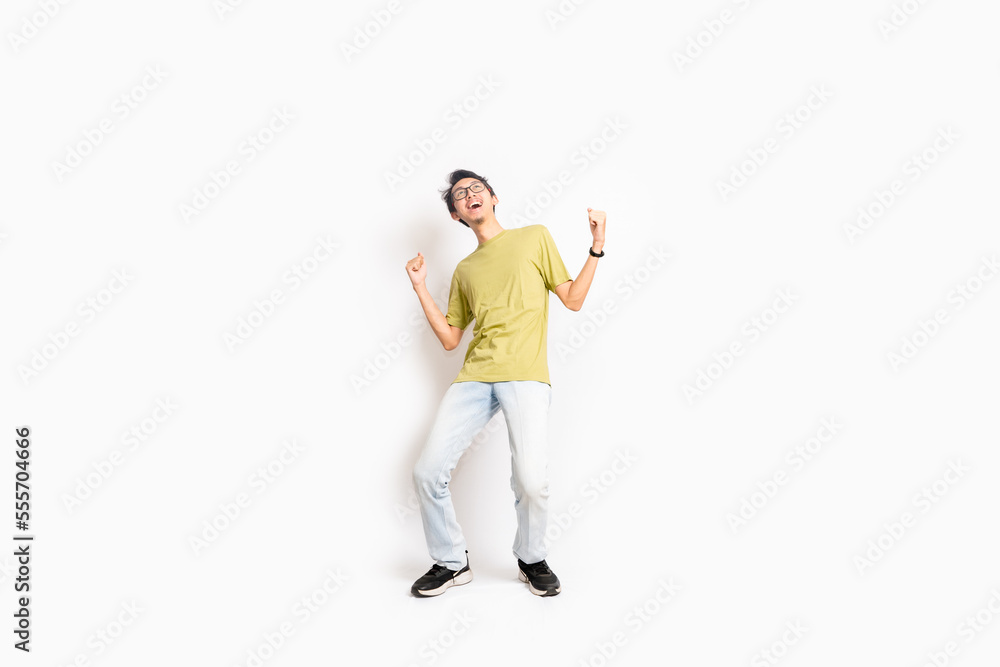 Single skinny young male. The full body of an Asian or Indonesian person. Isolated photo studio with white background. Single skinny young male. The full body of an Asian or Indonesian person. Isolated photo studio with white background.
