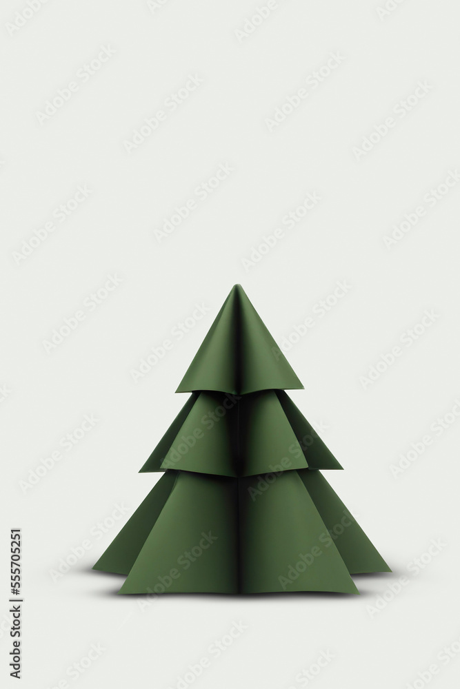 Fototapeta premium Origami style dark green colored christmas tree on a white background.