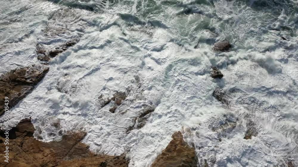 White ocean waves crashing on the rocks White ocean waves crashing on the rocks