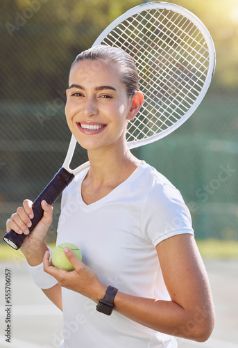Tennis game, sports portrait and woman training for professional event, happy on court in summer and smile for motivation in competition. Athlete ready for outdoor match, fitness and exercise © J Maas/peopleimages.com
