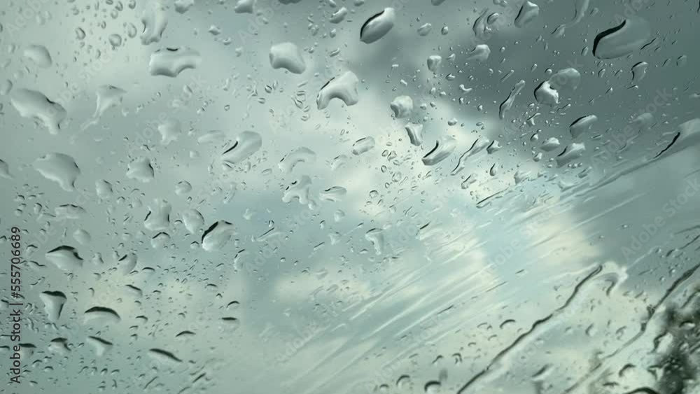 A glass with condensation on a rainy day A glass with condensation on a rainy day