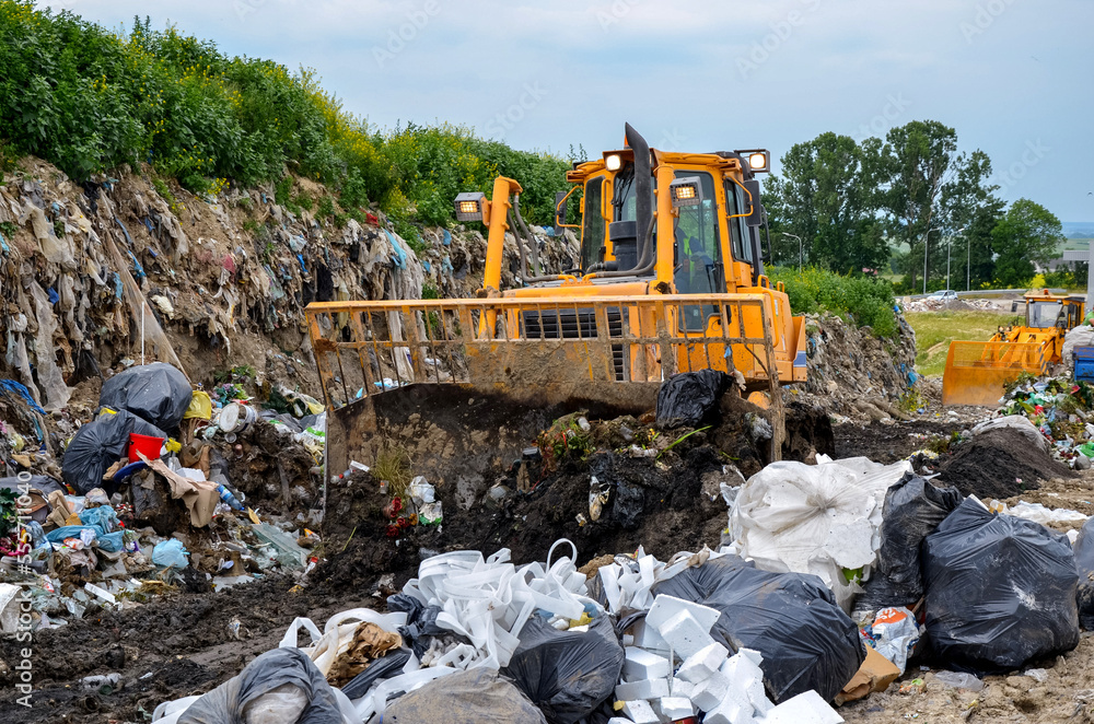 Crawler dozer working in landfill. Crawler dozer working in landfill.