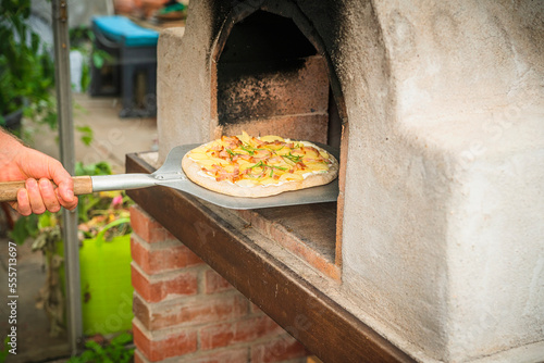 Homemade pizza on a shovel