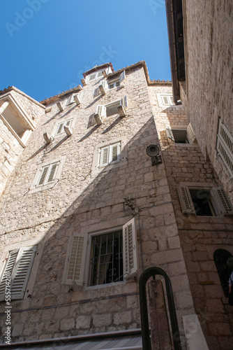 Fototapeta Naklejka Na Ścianę i Meble -  Old medieval wall with wooden window shutters in Split in Croatia