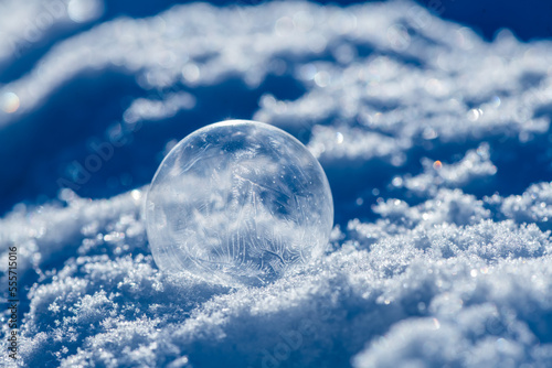 frozen soap bubble in the snow