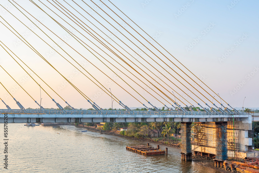 Obraz premium Cortalim, Goa - India - Dec 22nd 2022: New Zuari Bridge will be inaugurated on 29th December 2022 by Mr. Nitin Gadkari. Twin 4 Lane Zuari Bridge undertaken by Dilip Buildcon Ltd.