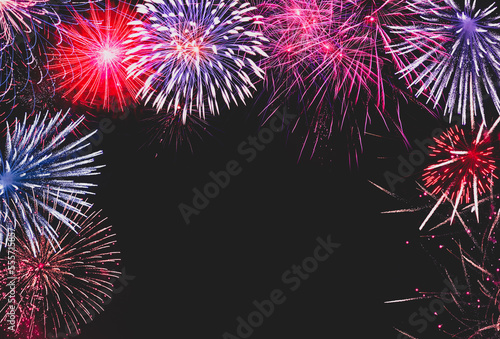 Background of fireworks in the night sky. New Year s celebration invitation concept.