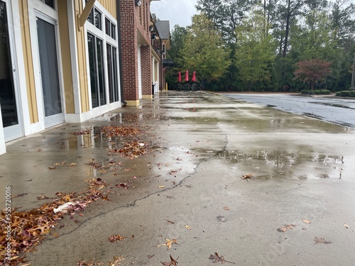 Grocery store retail strip mall rain on sidewalk in the fall in rural Georgia