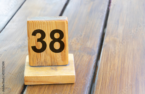 Wooden priority number 38 on a plank tab photo