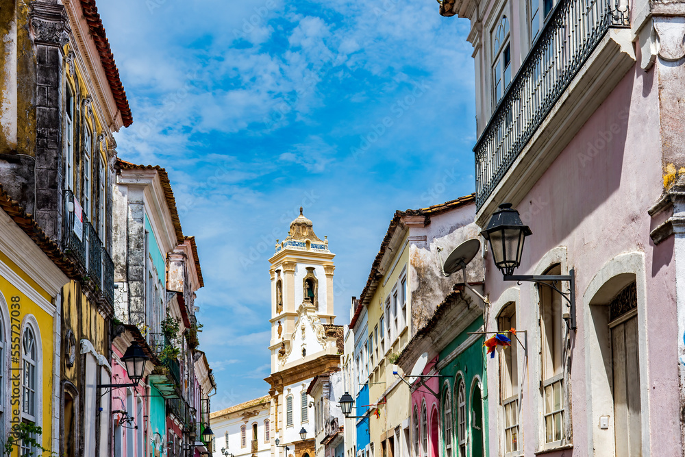 Old houses with colorful facades and historic baroque church tower in Pelourinho neighborhood in Salvador Bahia