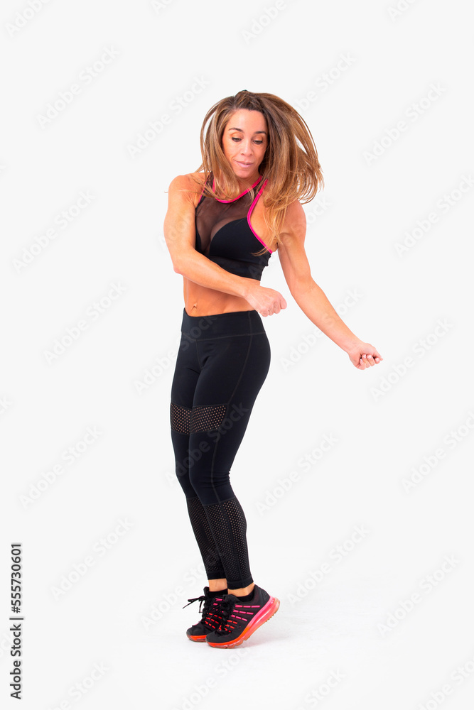 Mid age woman working out. Female fitness instructor exercising and working out HIIT. Strong woman working out. Fitness lifestyle. Mid age woman working out. Female fitness instructor exercising and working out HIIT. Strong woman working out. Fitness lifestyle.