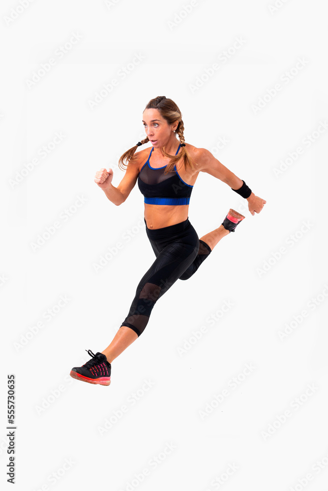 Mid age woman working out. Female fitness instructor exercising and working out HIIT. Strong woman working out. Fitness lifestyle.