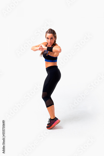 Mid age woman working out. Female fitness instructor exercising and working out HIIT. Strong woman working out. Fitness lifestyle.
