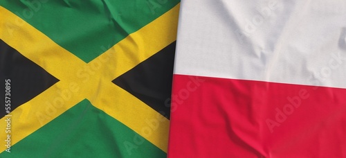 Flags of Jamaica and Poland. Linen flag close-up. Kingston, Caribbean. Polish. Flag made of canvas. State symbol. 3d illustration.