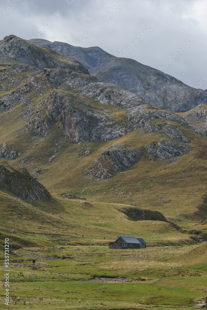 Landscape of Pyrenees Mountains with remote farm house building at the french and spanish border, Col du Pourtalet, Nouvelle-Aquitaine France