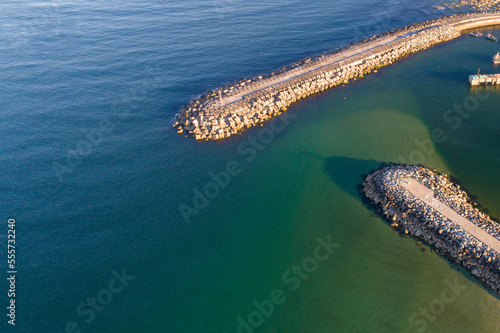 drone aerial view of a port harbor breakwater photo