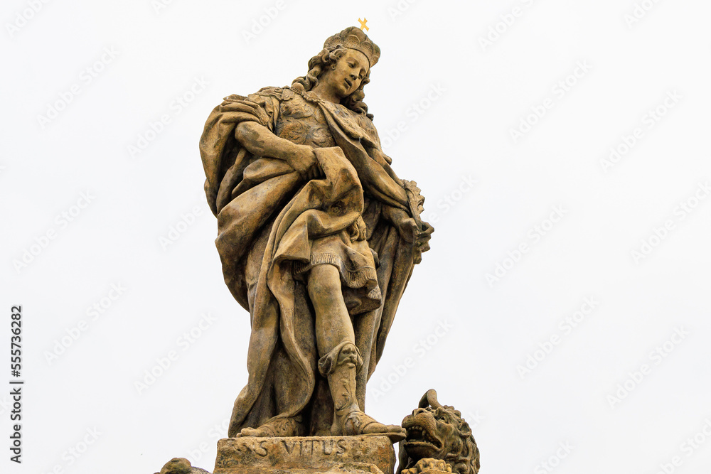 Fototapeta premium Ancient medieval sculptures on the Charles Bridge. Background with selective focus