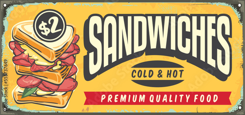 Delicious sandwiches retro yellow sign design layout with creative lettering and sandwich vector graphic. Vintage food and snacks advertisement.
