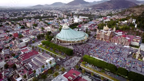 Aerial view of Basilica of Our Lady of Guadalupe. Virgin Mary's day pilgrimage. The old and the new Basilica. Basilica de Nuestra Señora Guadalupe, La Villa atrium Mexico City Drone dolly cenital shot