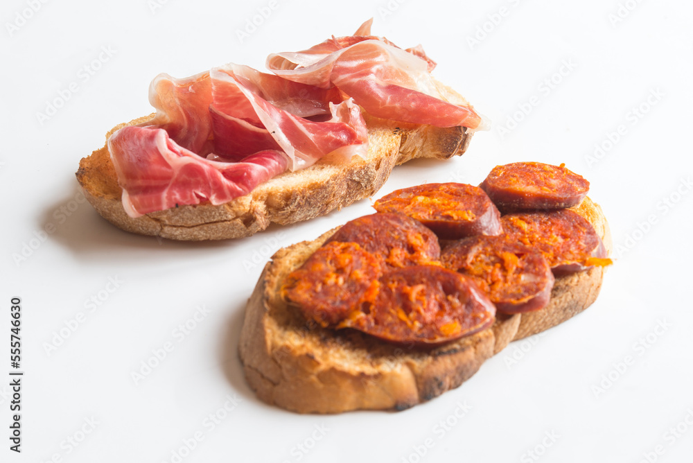 Slice of bread with chorizo and serrano ham Slice of bread with chorizo and serrano ham