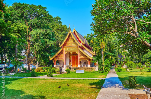 Ubosot of Wat Chiang Man amid green tropic garden, Chiang Mai, Thailand photo