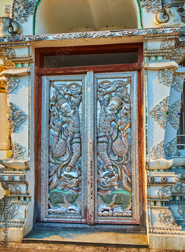 Carved wooden door of the vintage building, Chiang Mai, Thailand photo