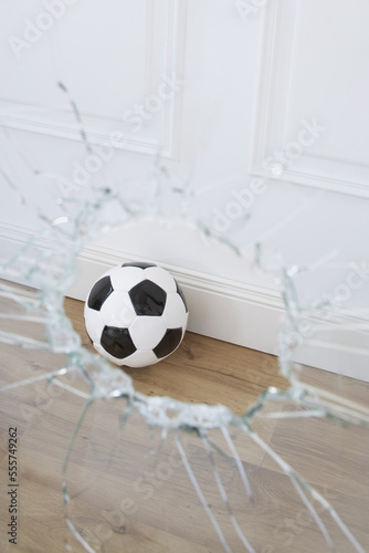 Soccer Ball and Broken Window photo