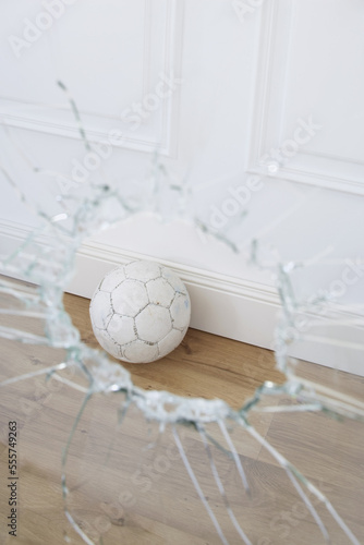 Soccer Ball and Broken Window photo
