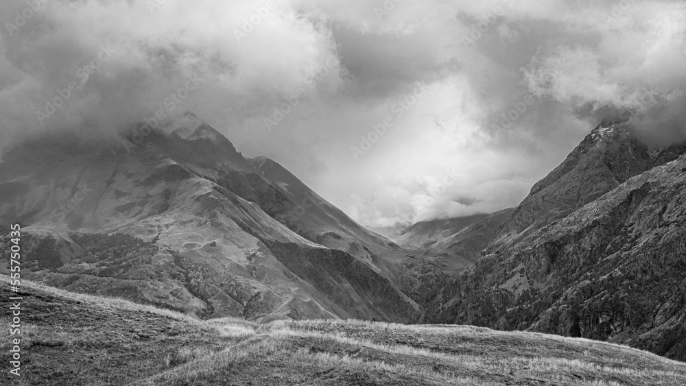 Autumn landscape in the mountains on hike from the hamlet of Les Cours to Lac du Pontet and back, near Villar d'Arene and Col du Lautaret, Hautes-Alpes, France Autumn landscape in the mountains on hike from the hamlet of Les Cours to Lac du Pontet and back, near Villar d'Arene and Col du Lautaret, Hautes-Alpes, France