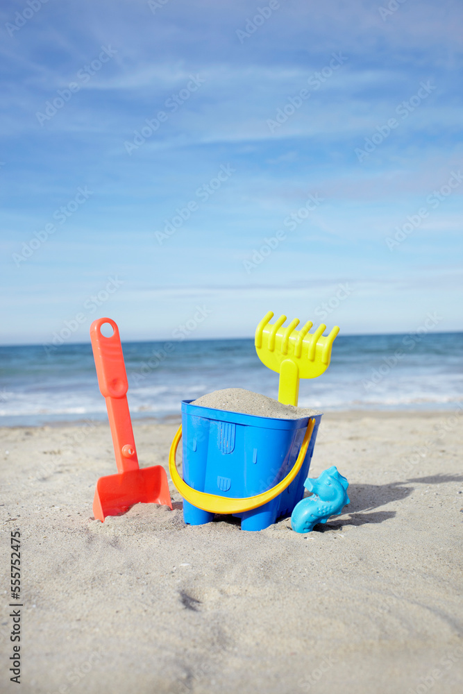 Toy Bucket, Shovel and Rake in Sand at Beach, Saint-Jean-de-Luz, Pyrenees-Atlantiques, France Toy Bucket, Shovel and Rake in Sand at Beach, Saint-Jean-de-Luz, Pyrenees-Atlantiques, France