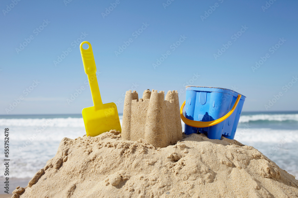 Sand Castle, Toy Bucket and Shovel at Beach, Biarritz, Pyrenees-Atlantiques, France Sand Castle, Toy Bucket and Shovel at Beach, Biarritz, Pyrenees-Atlantiques, France