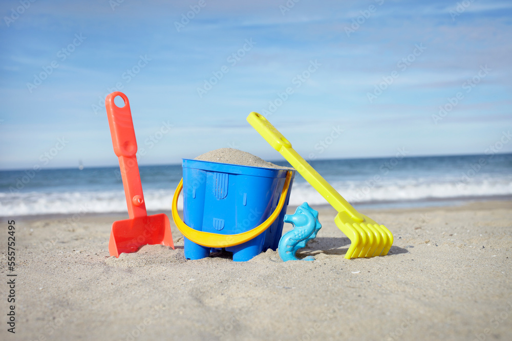 Toy Bucket, Shovel and Rake in Sand at Beach, Saint-Jean-de-Luz, Pyrenees-Atlantiques, France Toy Bucket, Shovel and Rake in Sand at Beach, Saint-Jean-de-Luz, Pyrenees-Atlantiques, France