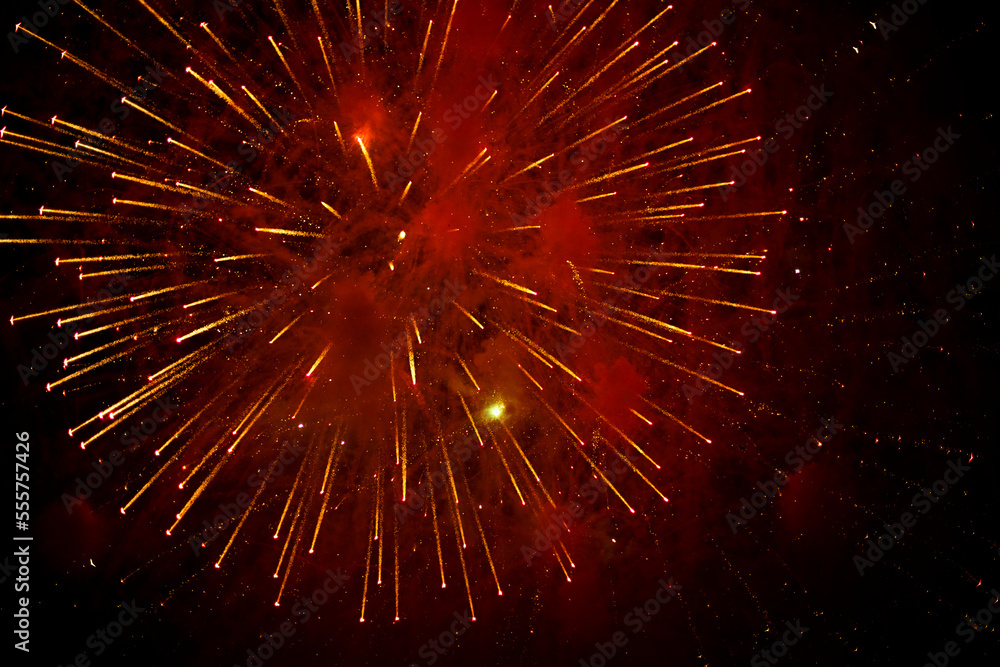 Fireworks in black sky. Explosions of pyrotechnics on holiday. Fireworks in black sky. Explosions of pyrotechnics on holiday.