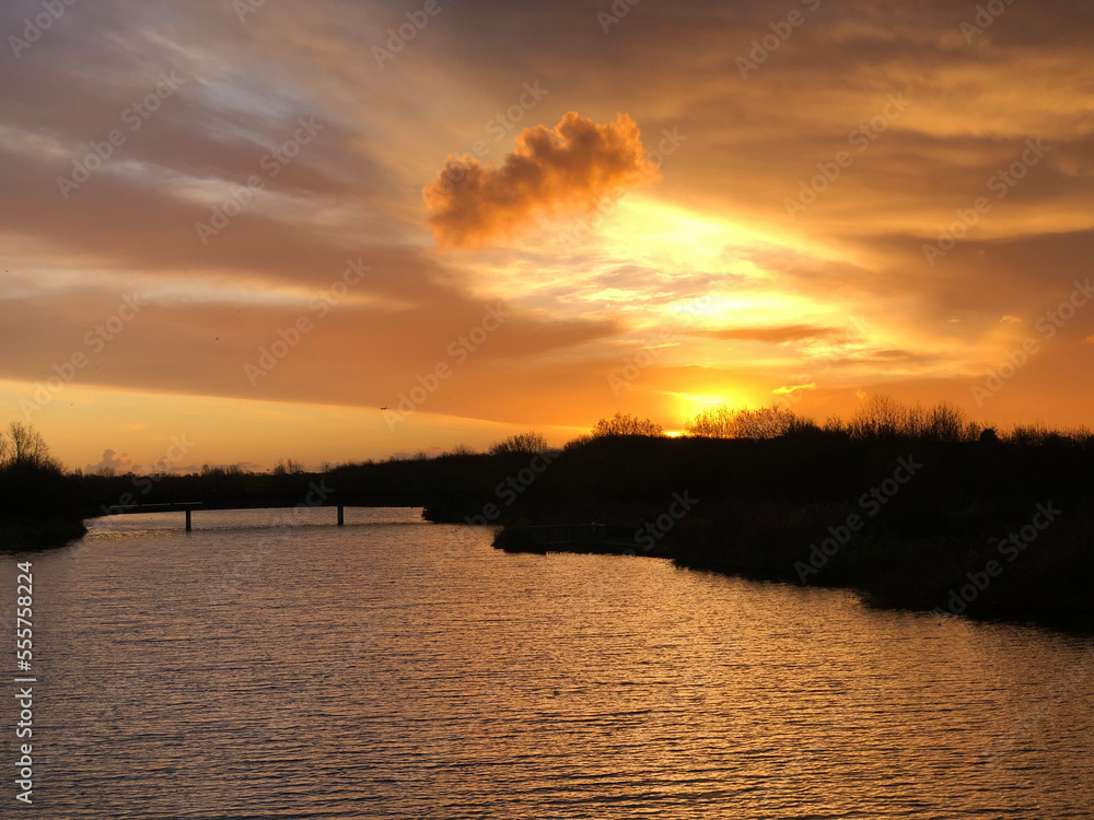 Naklejka premium sunset on the river