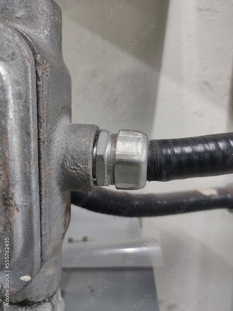 Conduit and clamp for cable electric ,Electrical Conduit with Clamp Installation on Roof ,Selective focus. Conduit and clamp for cable electric ,Electrical Conduit with Clamp Installation on Roof ,Selective focus.