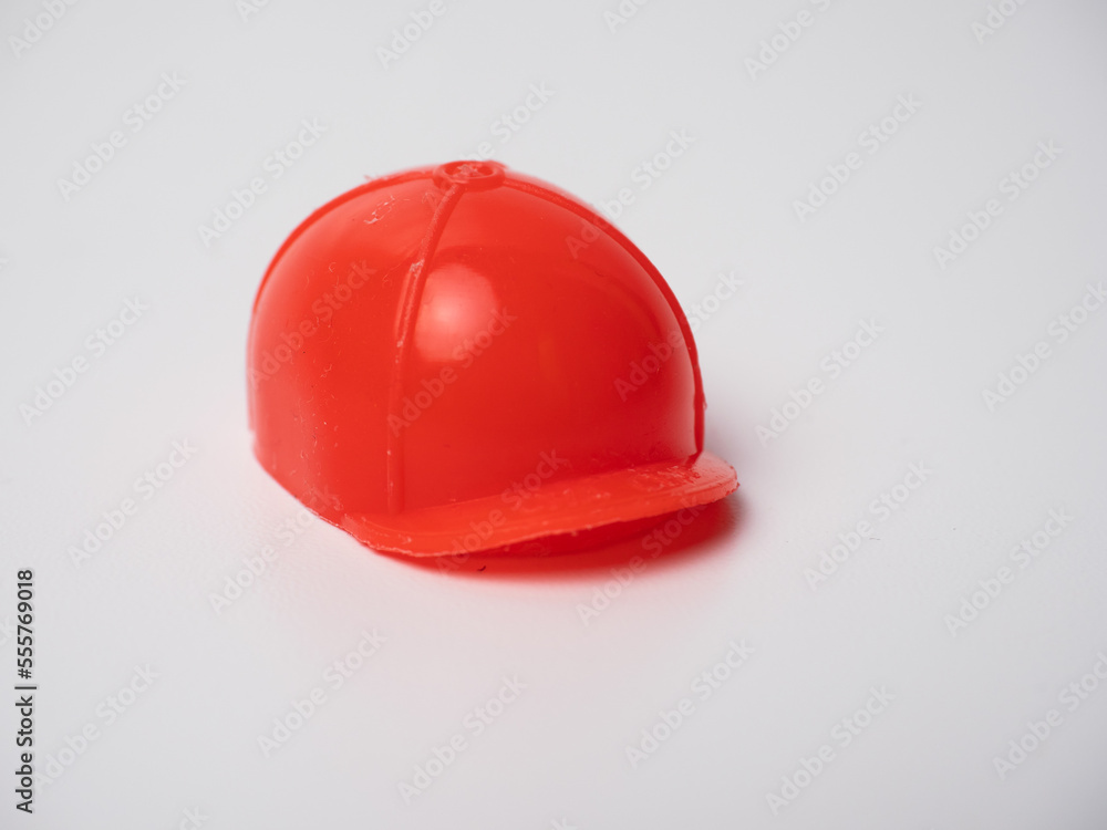 Fototapeta premium Picture of an orange plastic cap miniature