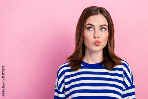 Close up photo of pretty cute lady wear stylish sailor clothes look empty space blow lips creative plan isolated on pink color background
