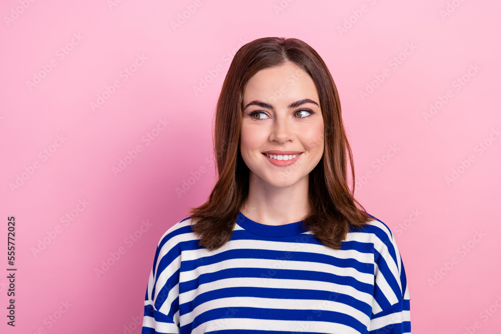 Close up photo of gorgeous cute lady dressed print pullover interested look empty blank space banner ad isolated on pink color background Close up photo of gorgeous cute lady dressed print pullover interested look empty blank space banner ad isolated on pink color background