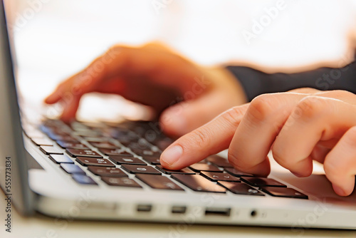 Person typing on a laptop