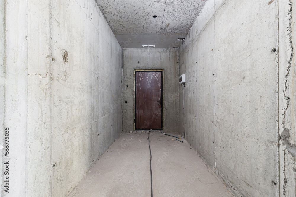Empty concrete commercial space without finishing with partitions Empty concrete commercial space without finishing with partitions