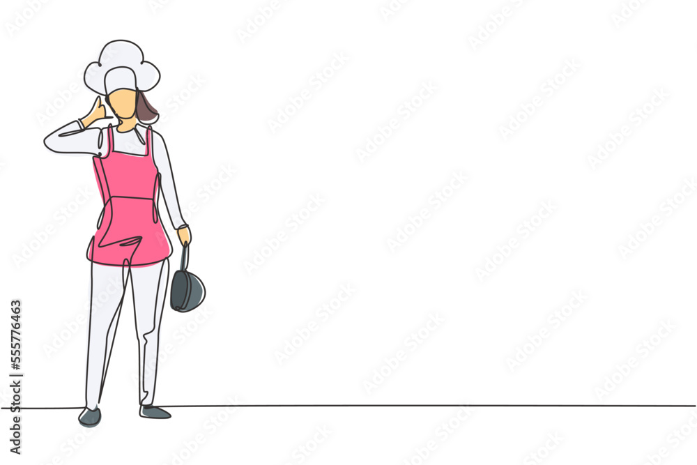 Single one line drawing female chef stands with call me gesture, holding pan and wearing cooking uniform prepares ingredients to cook dishes. Continuous line draw design graphic vector illustration