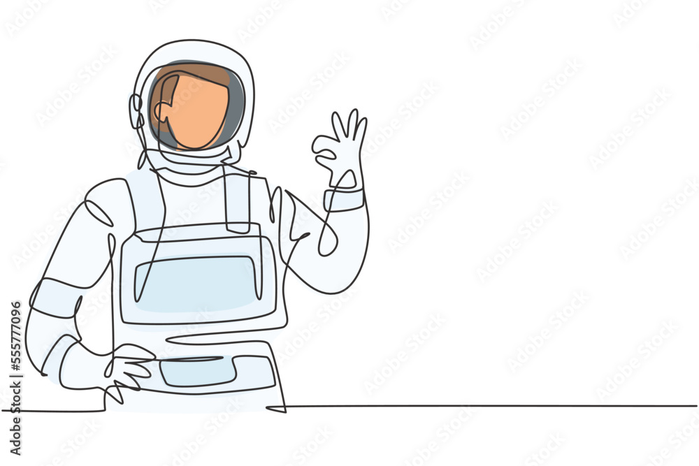 Single one line drawing of male astronauts with gesture okay wearing spacesuits to explore outer space in search mysteries of universe. Modern continuous line draw design graphic vector illustration