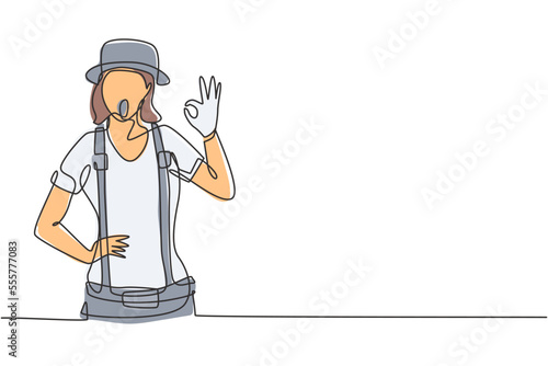 Continuous one line drawing female mime artist with gesture okay and white face make-up puts on a silent motion comedy show at circus arena. Single line draw design vector graphic illustration