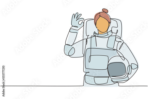 Continuous one line drawing female astronaut with gesture okay wearing spacesuits to explore outer space in search mysteries of universe. Great job. Single line draw design vector graphic illustration