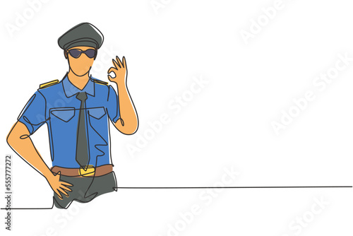 Single continuous line drawing male pilot with gesture okay and full uniform ready to fly with cabin crew in aircraft at international airport. Dynamic one line draw graphic design vector illustration